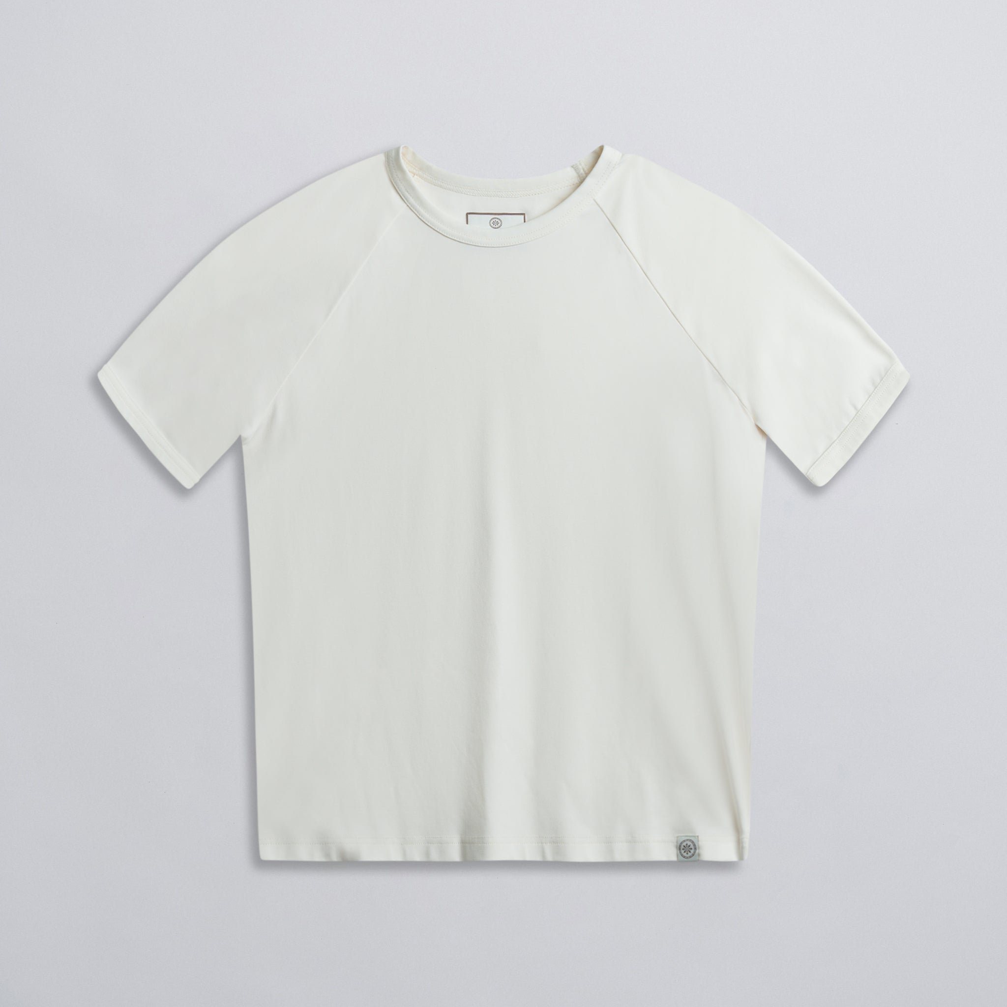 A plain white raglan tee with ribbed neck, displayed against a neutral background.