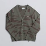 A green camouflage cardigan laid out flat against a white background.