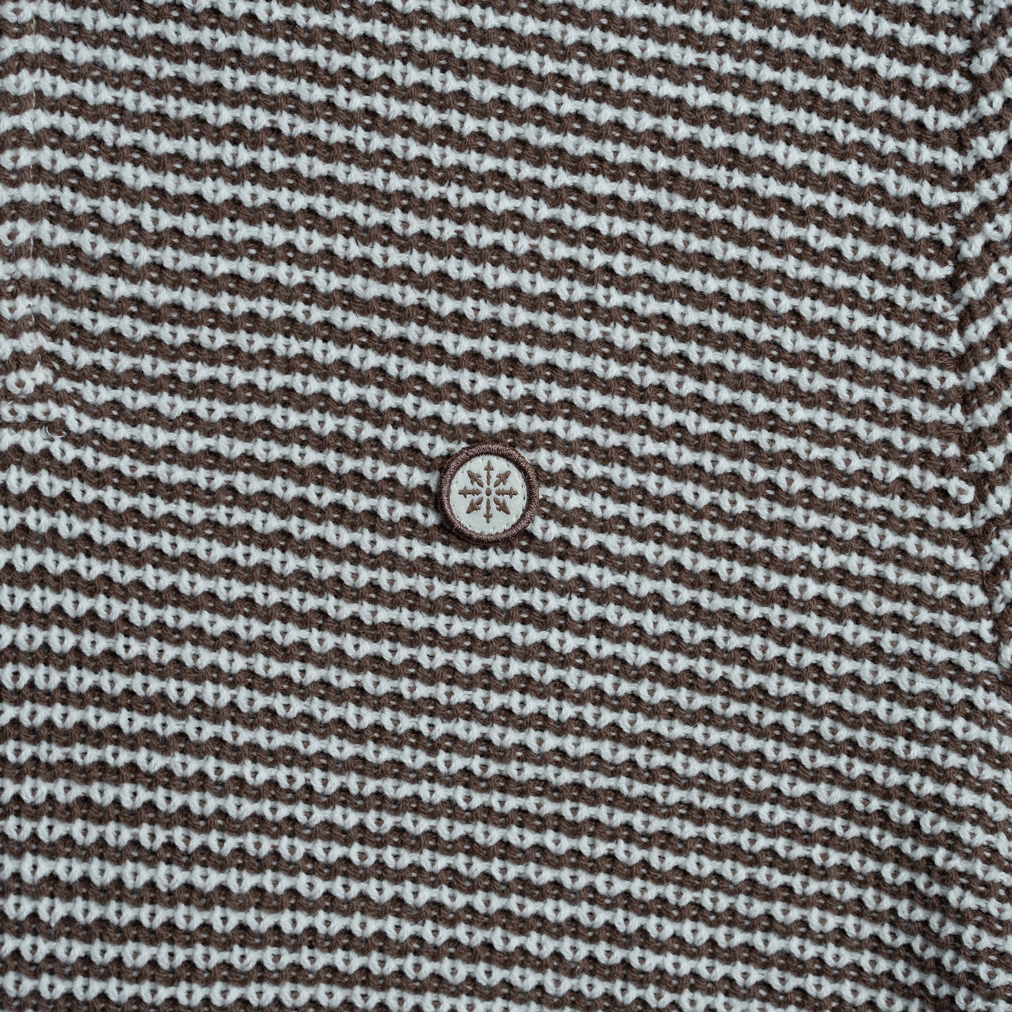 Close up of knit rugby shirt.