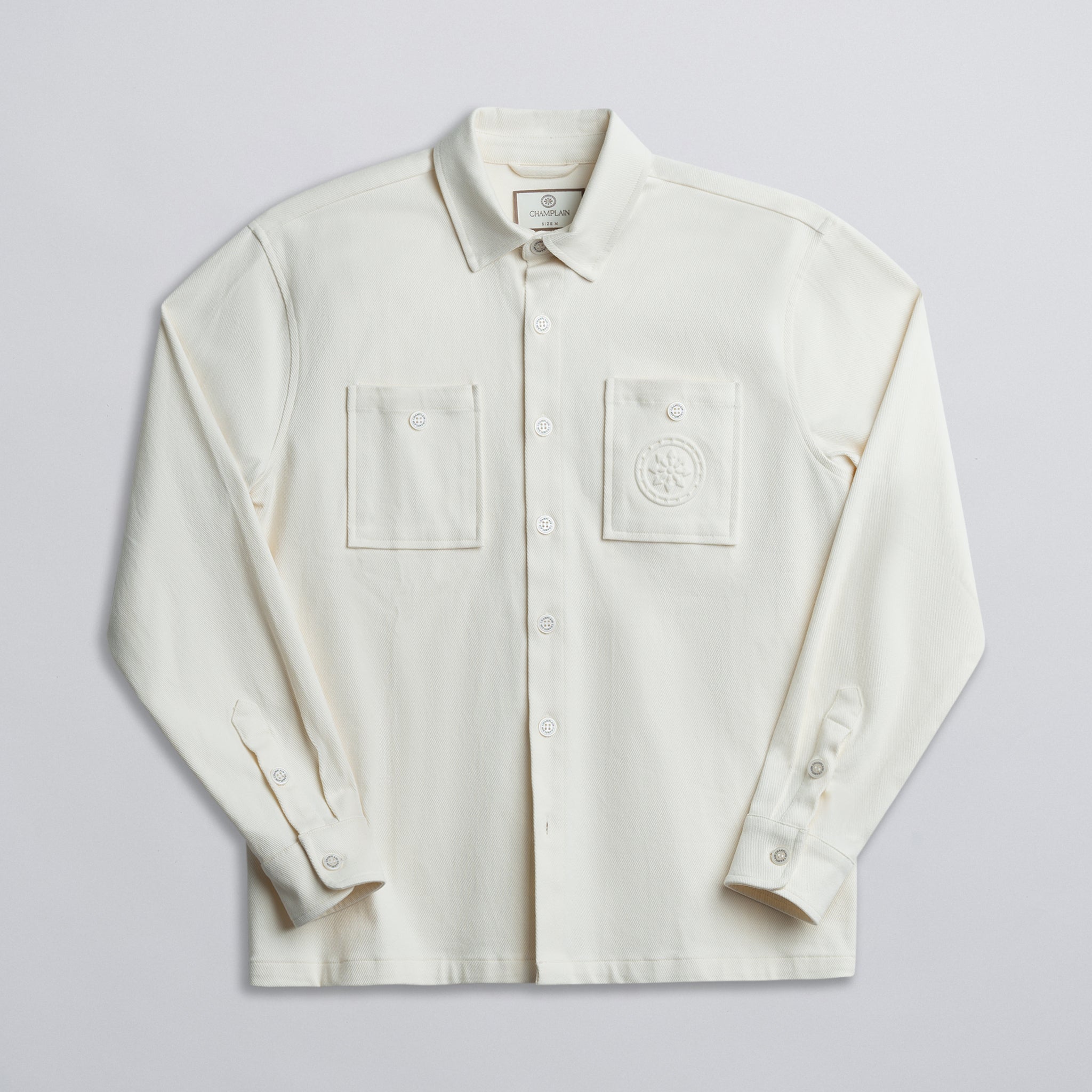 Overshirt with two chest pockets on a light gray background
