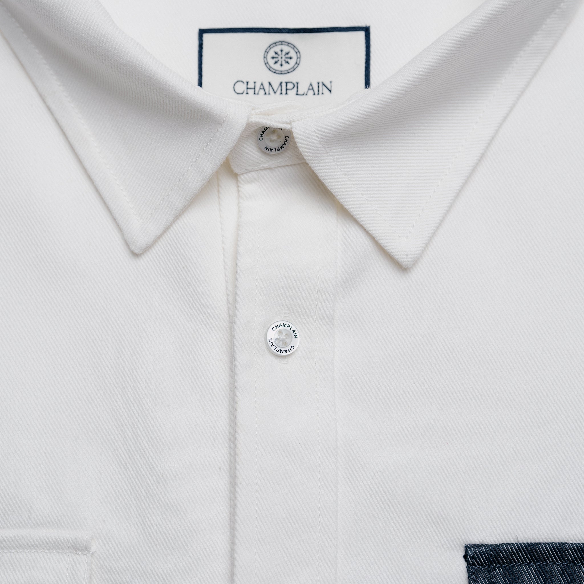 Close up of white denim overshirt.