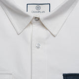 Close up of white denim overshirt.