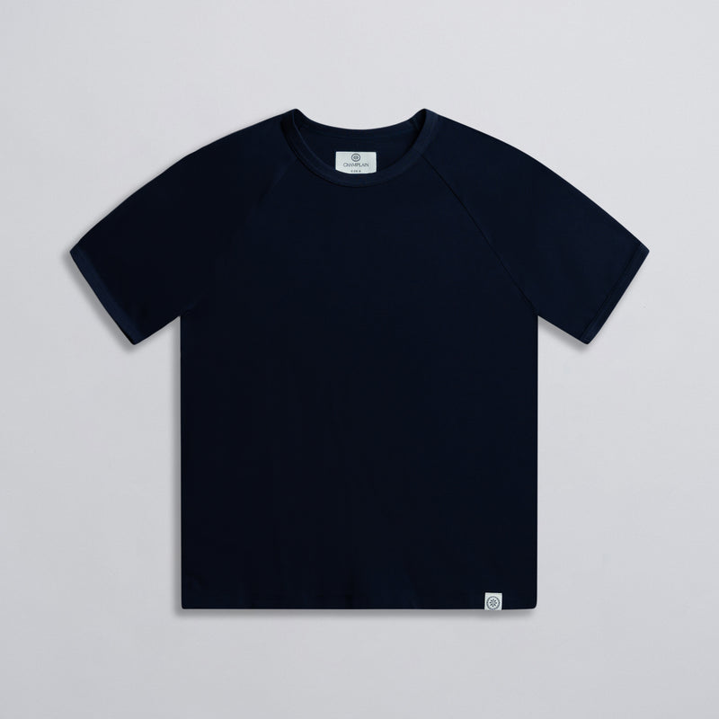 A navy colored basic raglan tee with ribbed neck, displayed against a neutral background.