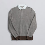A long-sleeved rugby shirt with a striped pattern, featuring a collar and button-up design, predominantly in brown color with white and darker brown stripes.