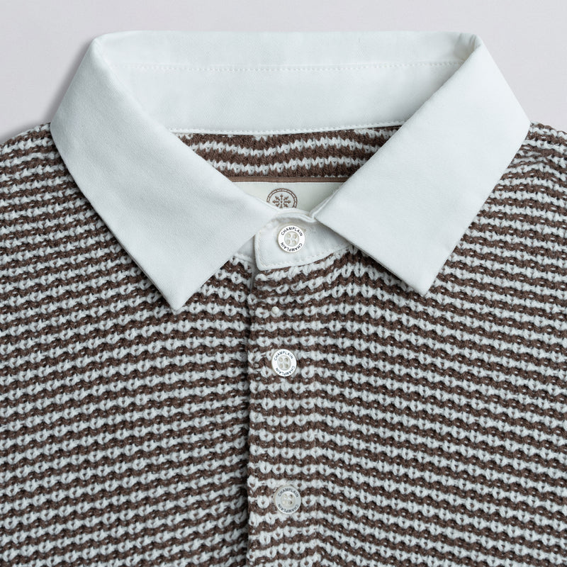 Close up of collar on a knit rugby shirt.